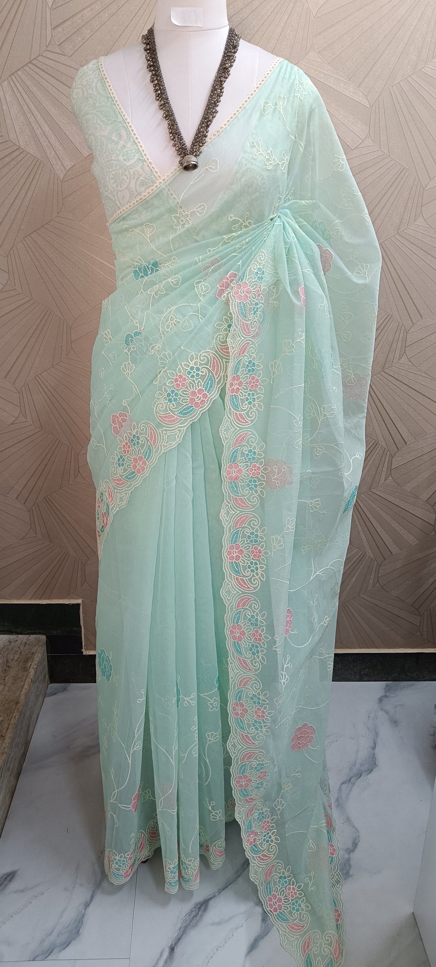 Pastel Embroidered Net Saree With Multicolor Floral Border